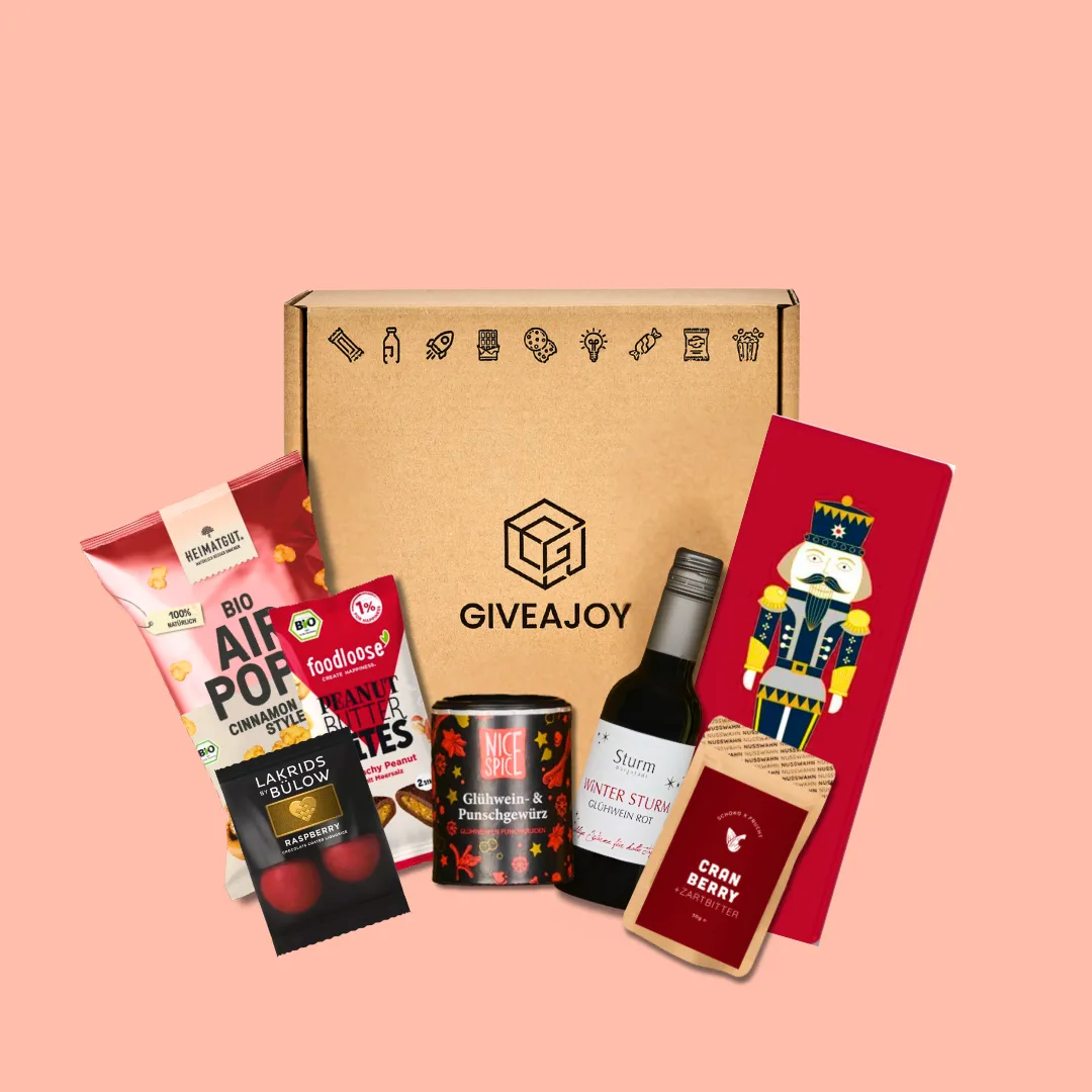 Geschenkbox mit Bio-Popcorn, Erdnussbutter, Glühweingewürz, Glühwein, Schokolade und Lakritz.