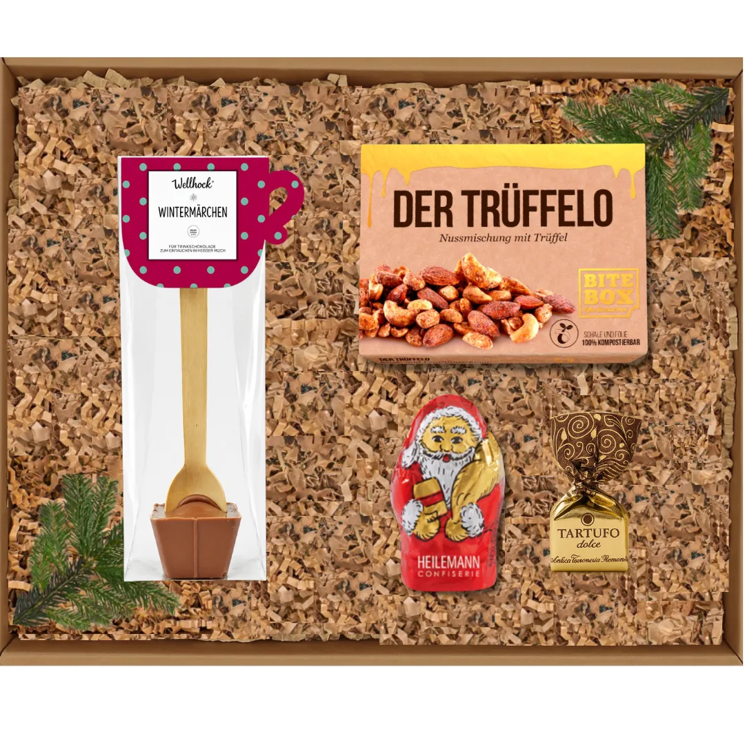 Geschenkbox mit Nussmischung, Tartufo-Schokolade, Trinkschokolade und Weihnachtsmann-Schokofigur.