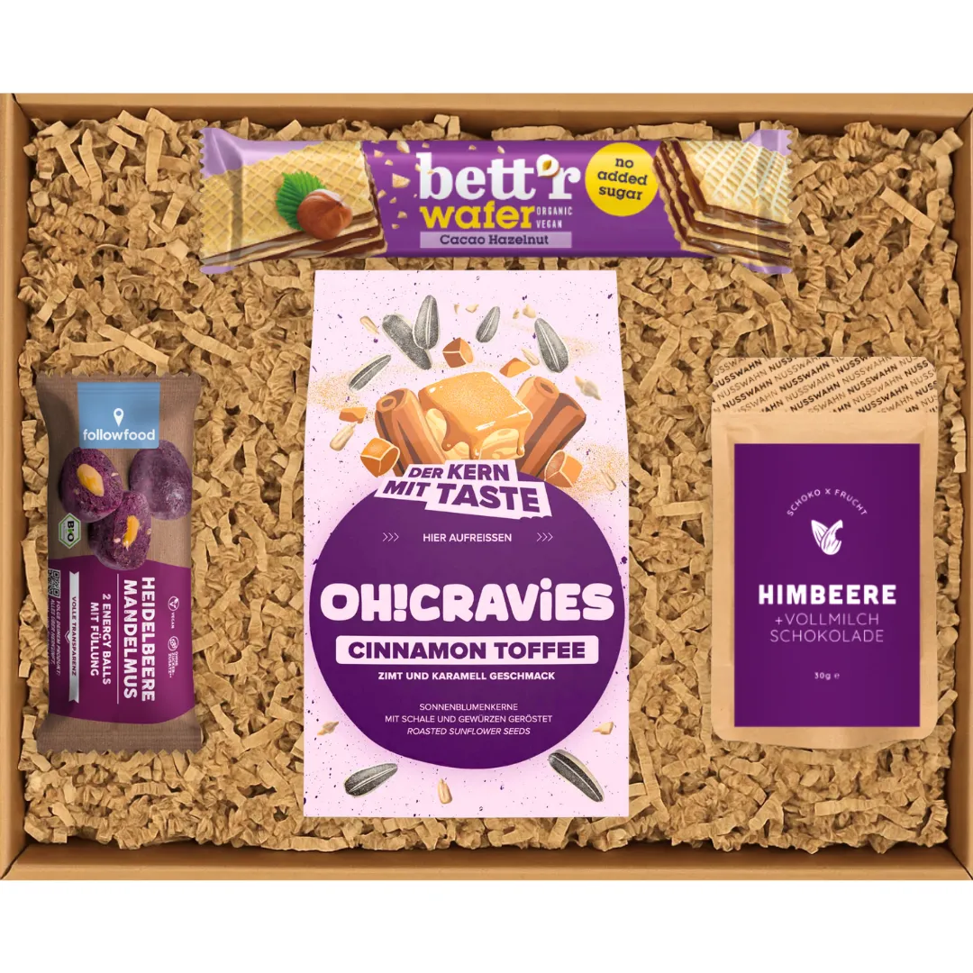 Geschenkbox mit Bett'r Wafer, OH!CRAVIES Cinnamon Toffee, Heidelbeere Mandelmus und Himbeer-Schokolade.